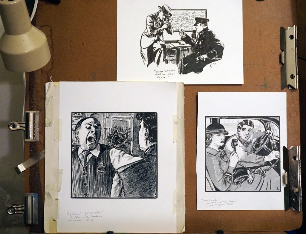 Three book illustration on the drawing board
